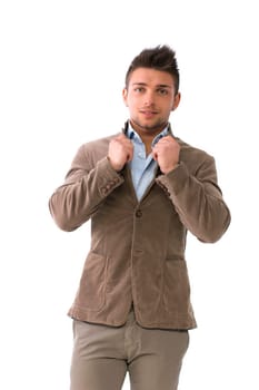 Handsome young man with winter jacket, isolated on white, holding shirt neck