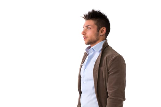 Handsome young man portrait, standing isolated on white, profile position
