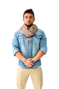 Handsome young man standing with denim shirt and scarf, looking at camera, isolated
