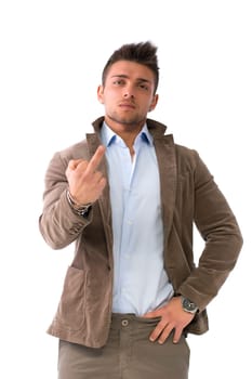 Handsome young man doing 'screw you' sign with middle finger, isolated on white