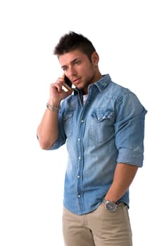 Handsome young man talking on cell phone (mobile), isolated on white. Looking away