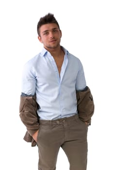 Handsome young man portrait, standing with jacket pulled down from shoulders