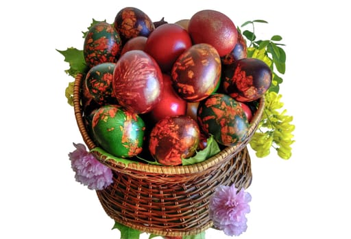 Very beautiful and colorful eggs inside a basket with mirror floor.