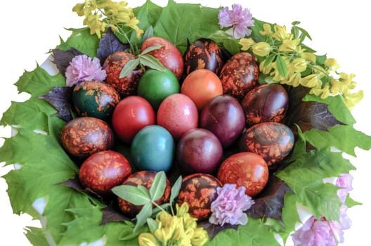 Very beautiful and colorful eggs inside a plate with mirror floor.