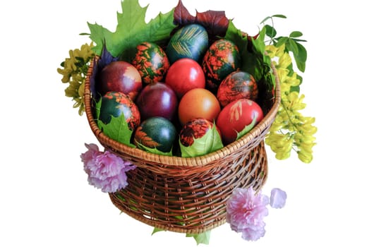 Very beautiful and colorful eggs inside a basket with mirror floor.