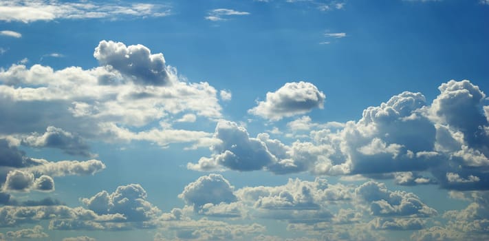 Blue sky background with a tiny clouds