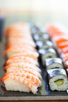 Closeup of rows of healthy freshly prepared sushi