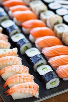 Closeup of rows of healthy freshly prepared sushi rolls