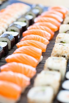 Closeup of rows of healthy freshly prepared sushi rolls