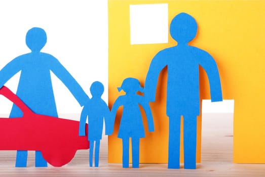 A blue Paper Family in front of their Home with their Car, close-up, isolated