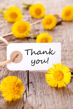 Yellow Flowers with a Tag with the Words Thank You on it