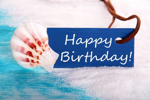Blue Label with Happy Birthday on it at the Beach