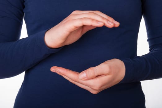 A Womans Hands Holding Copyspace between Her Hands, Isolated