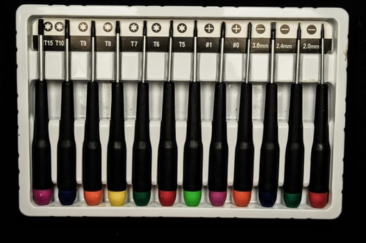 A set of screwdriver on a black background