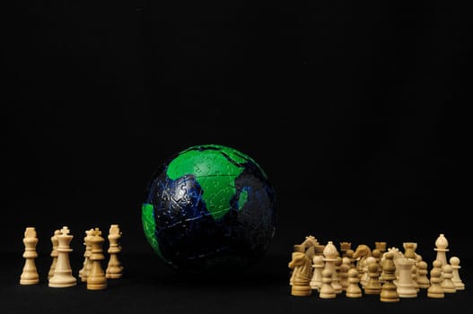 Globe And White Chess on a Black Background