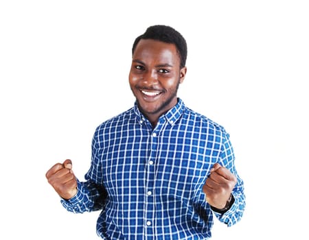 A handsome young black man in a colorful shirt and stretched out arms.making fist's and smiling, isolated for white background..