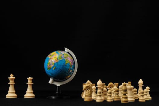 Globe And White Chess on a Black Background
