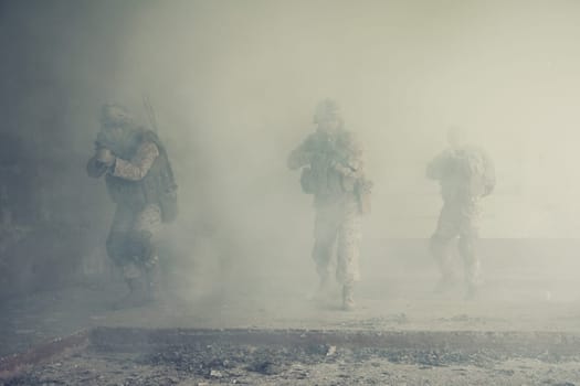 Squad of US marines in action in ruined building
