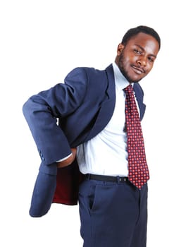 A young black business man standing in a blue suit and tie with his hands.behind his back, isolated for white background..