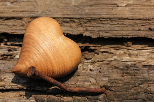 Wooden heart with weathered background