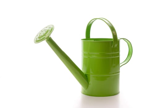 Green watering can on a white bcakground