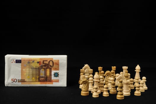 Money Strategy Concept White Chess and Currency on a Black Background