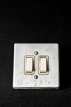 Light switch, old-style on a Black Background