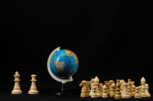 Globe And White Chess on a Black Background