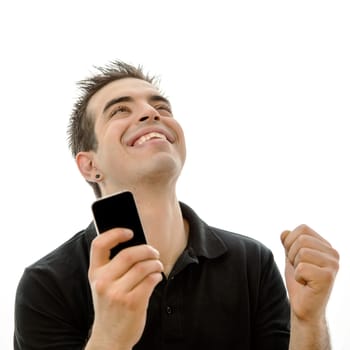 Happy young man looking at his smartphone against white background
