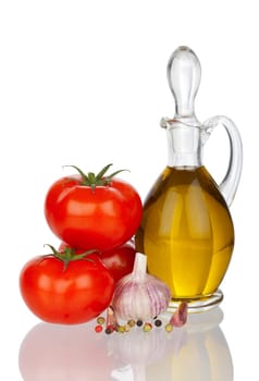 Carafe with olive oil,tomatoes and garlic,mirrored
