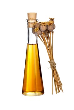 Bottle of poppy seed oil and poppy pods,insulated