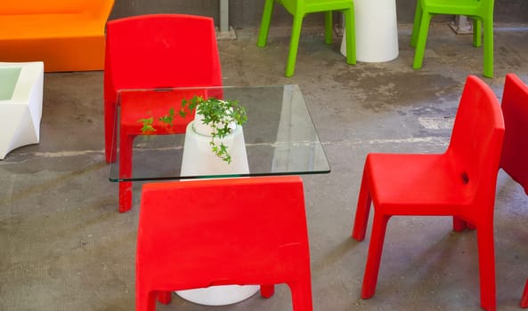 View of red and green plastic chairs