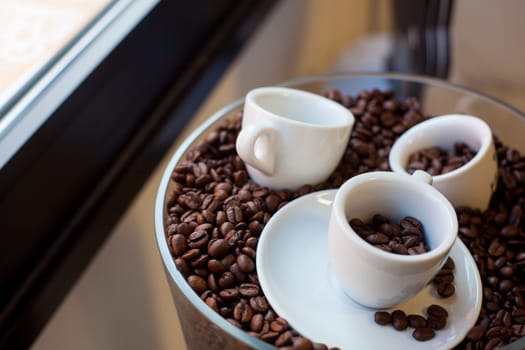 View of coffee cups and coffee beans