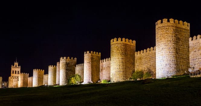 Walls of Avila Spain, night image with artificial lighting.