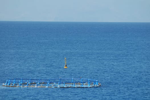 Fish Farm in the Atlantic Ocean on a Blue Day