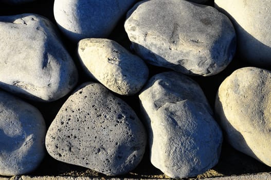 Texture of Round Rocks Smoothed by the Water