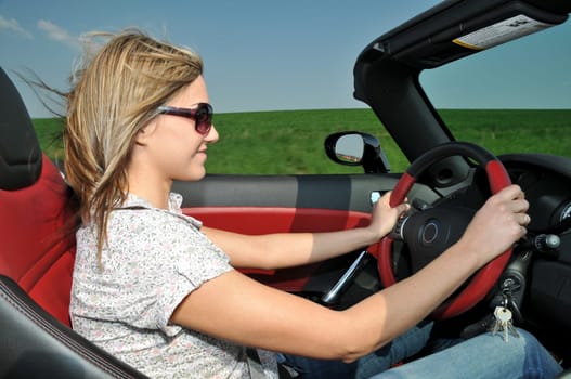 Woman in a convertible