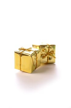Golden gift boxes on a white background