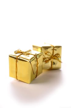 Golden gift boxes on a white background