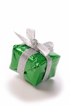 Green gift box with a bow