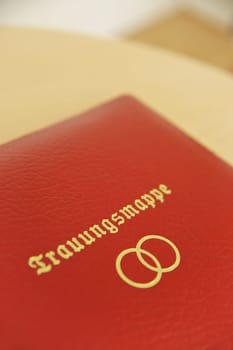 Red german wedding book with golden letters