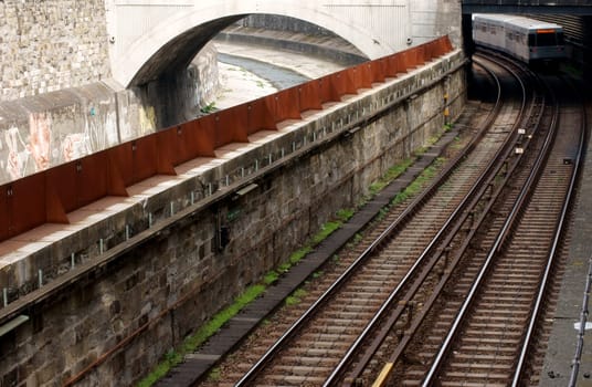 The photograph of the Austrian tram network with an adjacent water canal.