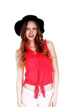 A slim young woman in a red blouse and shorts with a black hat standing.isolated for white background..