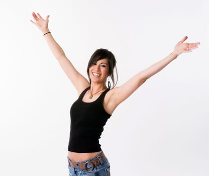 Woman motions towards the sky arms outstretched