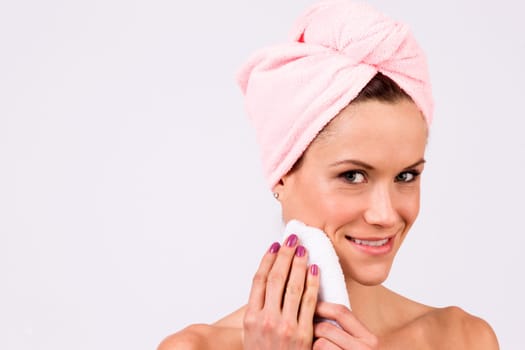 Beautiful woman just out of the shower wearing towel on her head