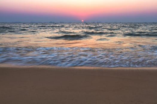 Scenic view from sand beach in Goa to beautiful sunset above the Arabian sea