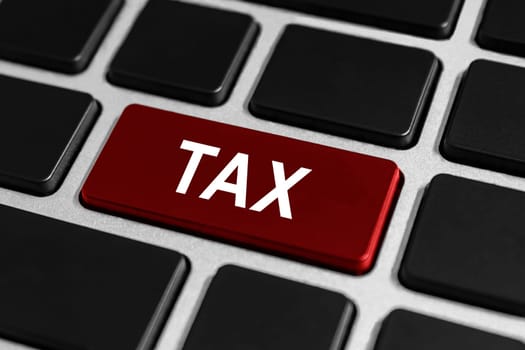 Accounting tax red button on keyboard, business concept