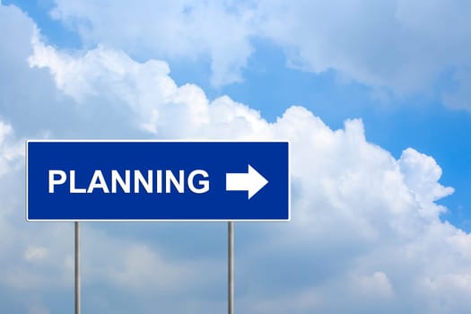 financial planning on blue road sign with blue sky