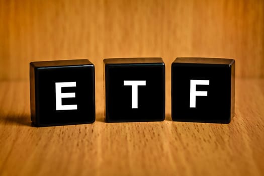 ETF or Exchange Traded Fund text on black block