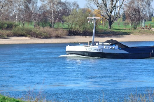 A barge on the Rhine,it is designed for sailing on inland waters and inland waterways.